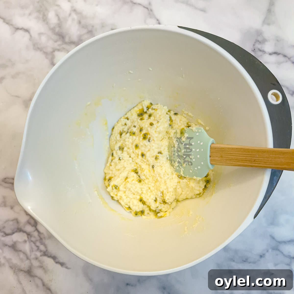 Granadilla pulp stirred into the cake batter.