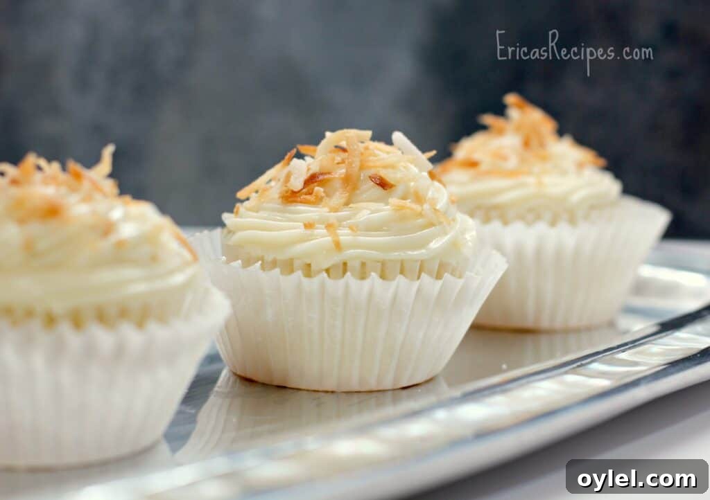 Honey Cream Cheese Frosted Pineapple Coconut Cupcakes 2 Pineapple Coconut Cupcakes with Honey Cream Cheese Frosting - EricasRecipes.com