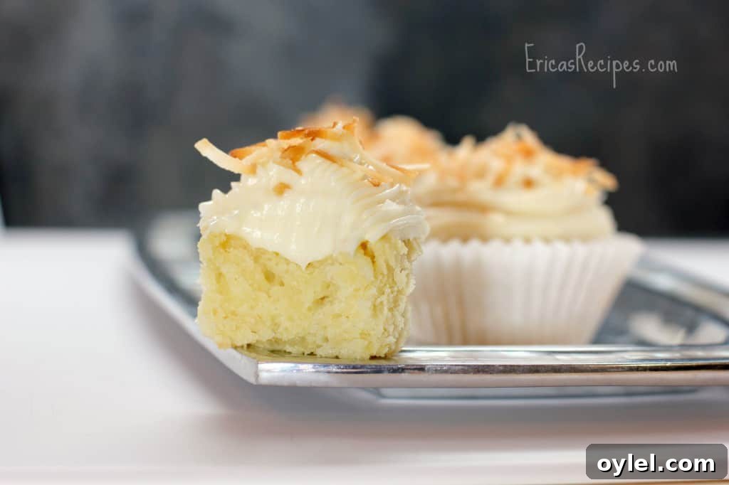 Honey Cream Cheese Frosted Pineapple Coconut Cupcakes 3 Pineapple Coconut Cupcakes with Honey Cream Cheese Frosting - EricasRecipes.com