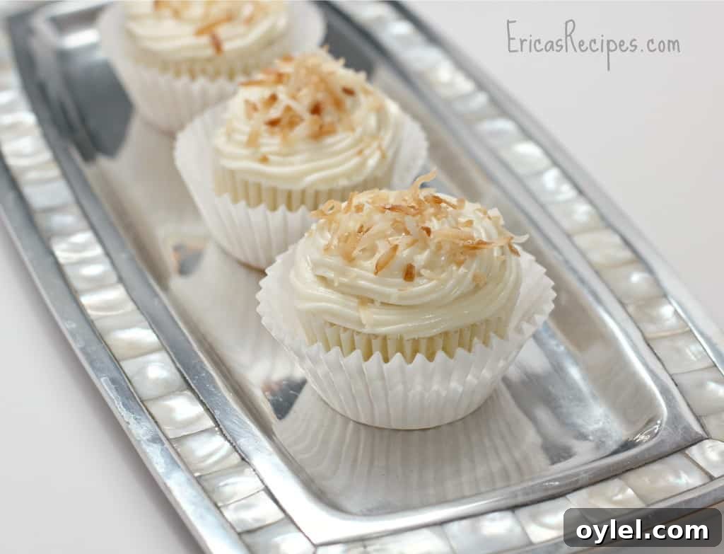 Honey Cream Cheese Frosted Pineapple Coconut Cupcakes 6 Pineapple Coconut Cupcakes with Honey Cream Cheese Frosting - EricasRecipes.com