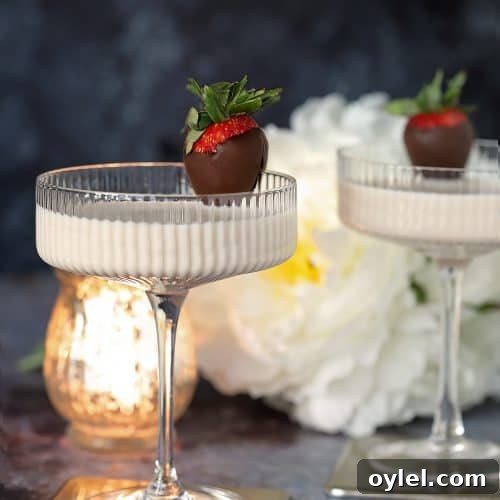 Disaronno Velvet Espresso Martini Cocktail in a ribbed cocktail glass and garnished with a chocolate covered strawberry.