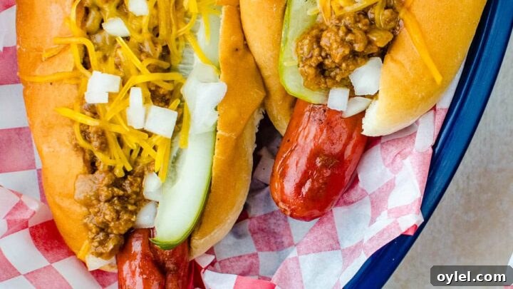 Grilling Recipes for Every Occasion: Weeknights to Holidays 18 Chili cheese dogs in a basket with all the toppings.