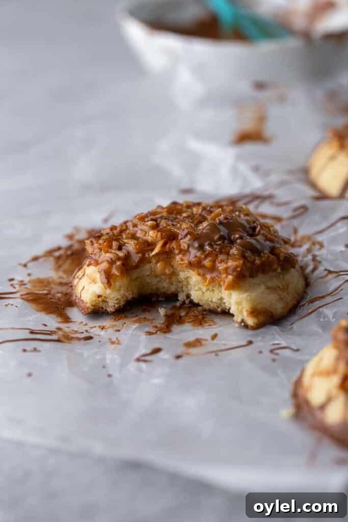 Caramel coconut fudge cookie with a bite taken out of it