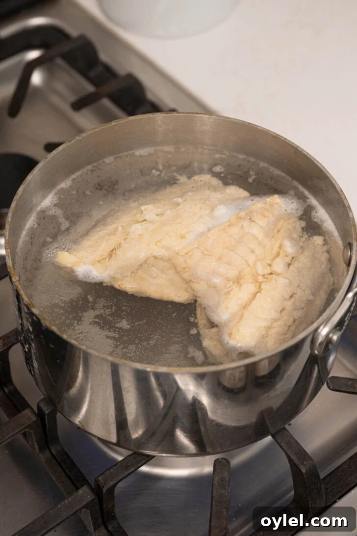 Authentic Bacalao Guisado: Stewed Salt Cod Recipe 2 A pot of water and salted codfish.