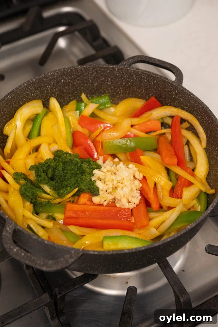 Authentic Bacalao Guisado: Stewed Salt Cod Recipe 3 A pot with peppers, onions, and more.