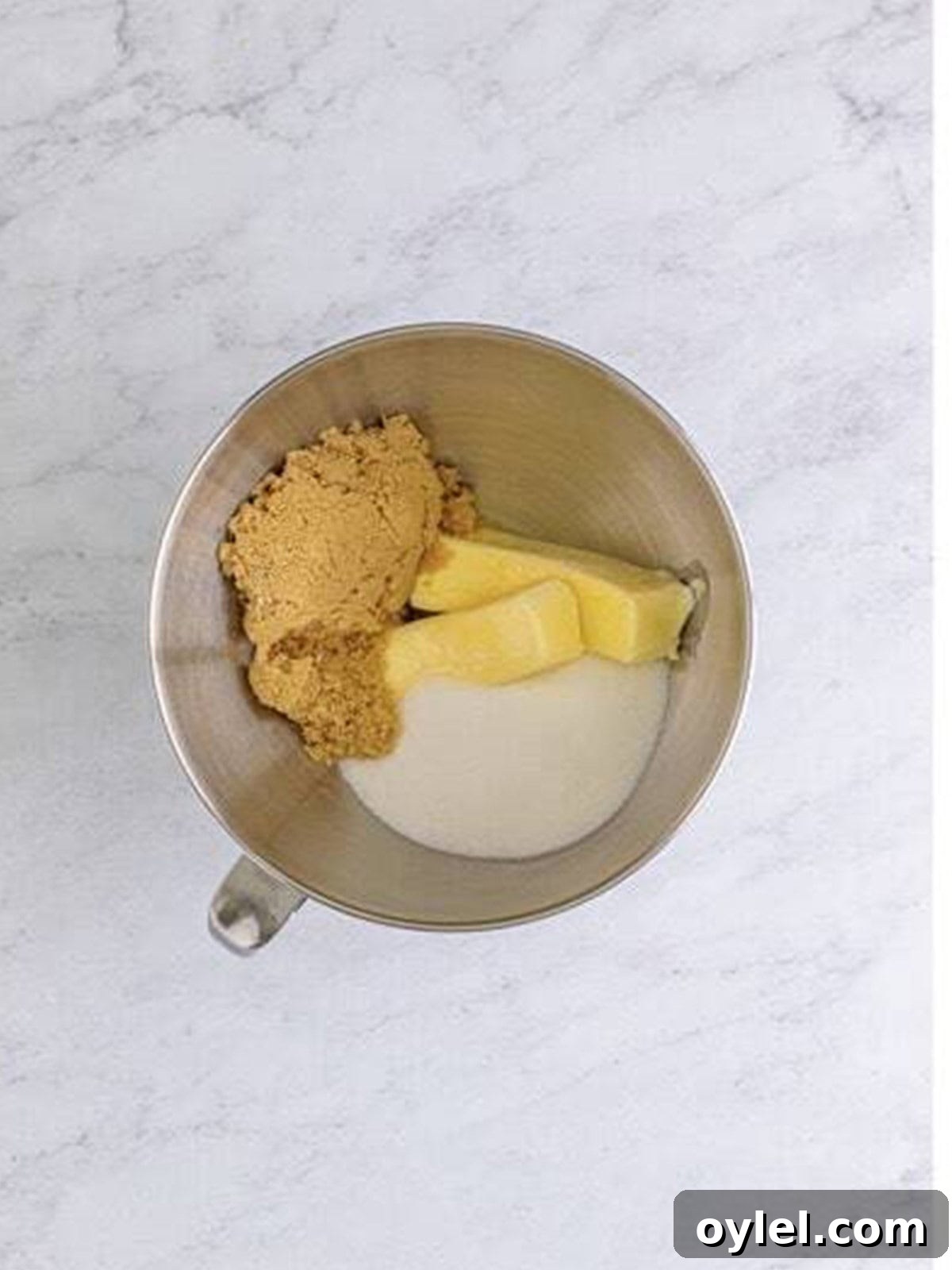 Creaming butter and sugar in a stand mixer for the cupcake batter.