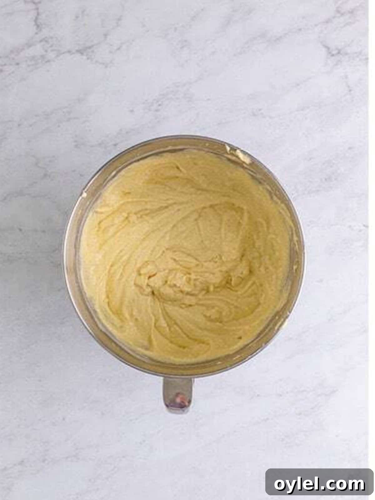 The finished pineapple cake batter in a mixing bowl.