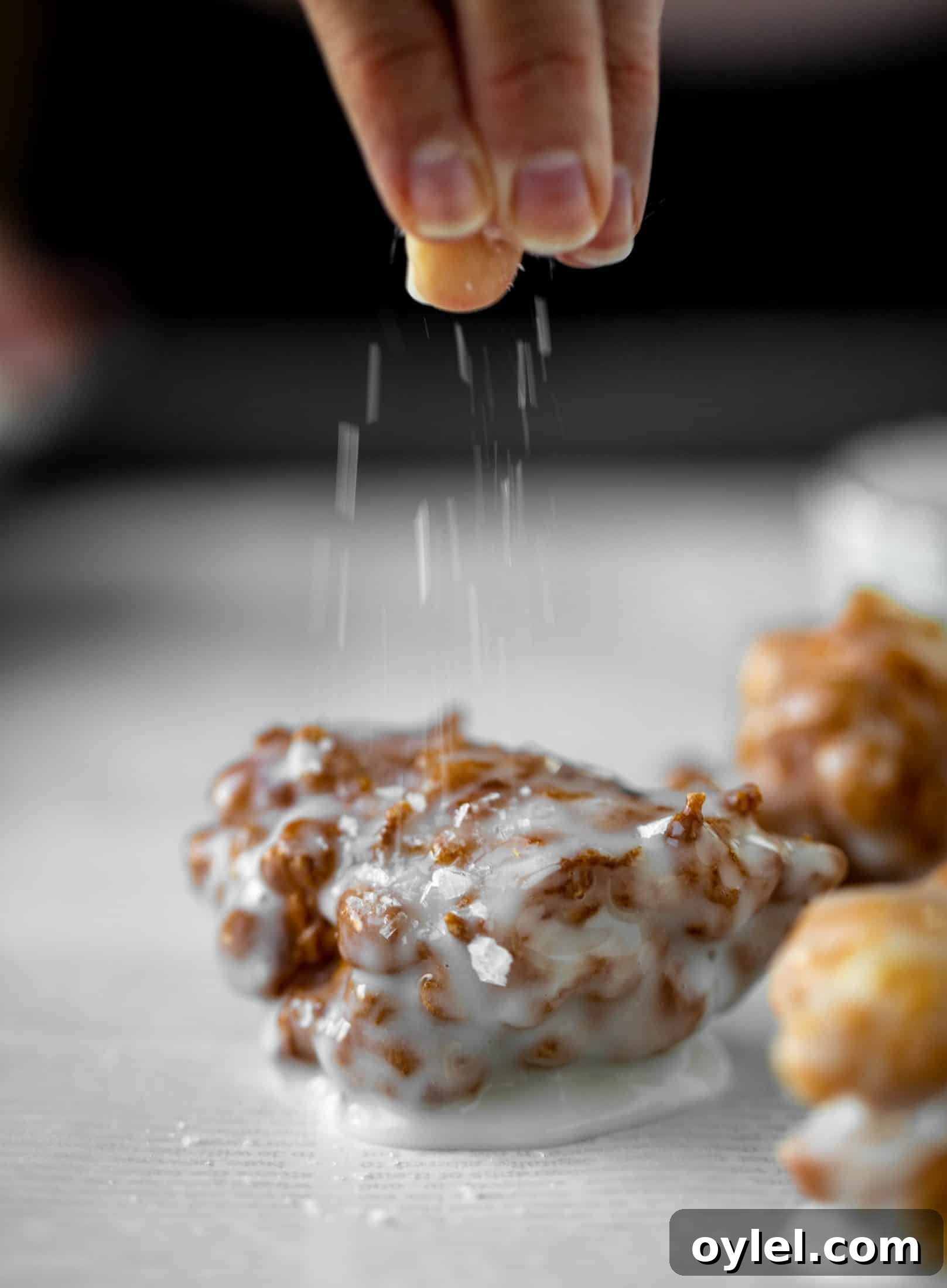 These salted apple fritters use honeycrisp apples and flaked sea salt for a fall flavor explosion. These are the best treat ever!