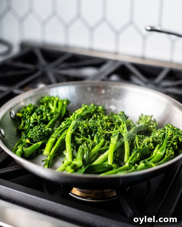 Garlic Parmesan Sauteed Broccolini 2 Broccolini cooking in a skillet