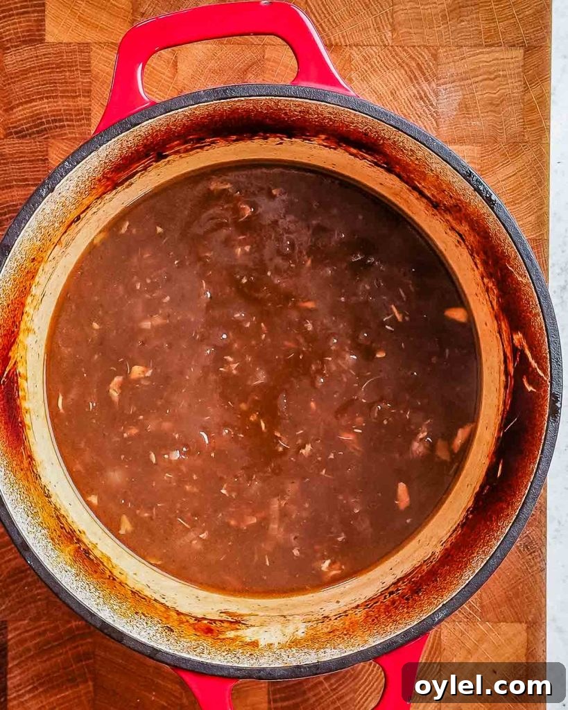 Balsamic Chicken with Caramelized Onions and Garlic 9 Thickened balsamic gravy in a deep pan.