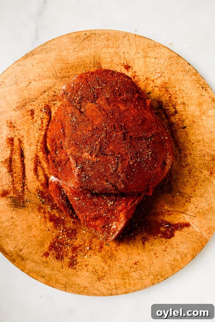 A pork shoulder coated in a dry spice mixture.