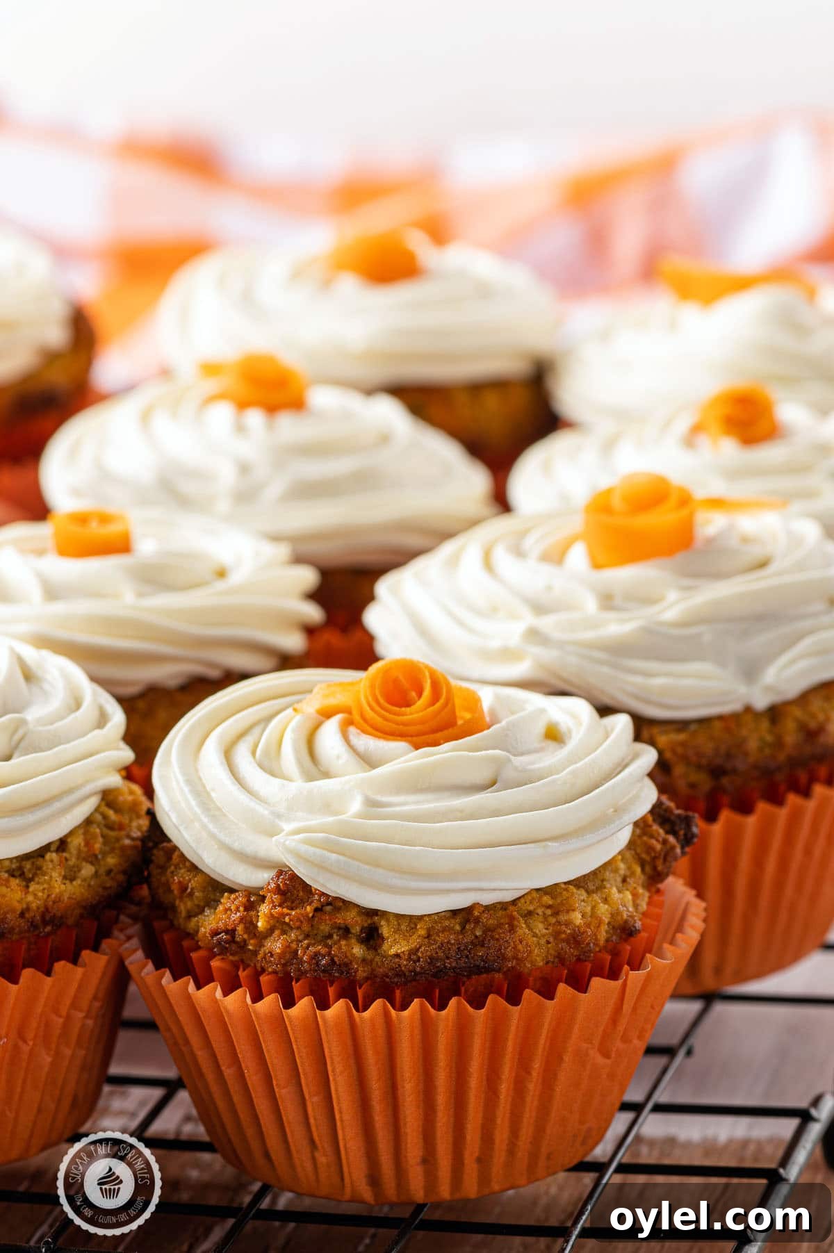 Keto carrot cake muffins with cream cheese frosting, a low-carb, gluten-free breakfast or dessert option.