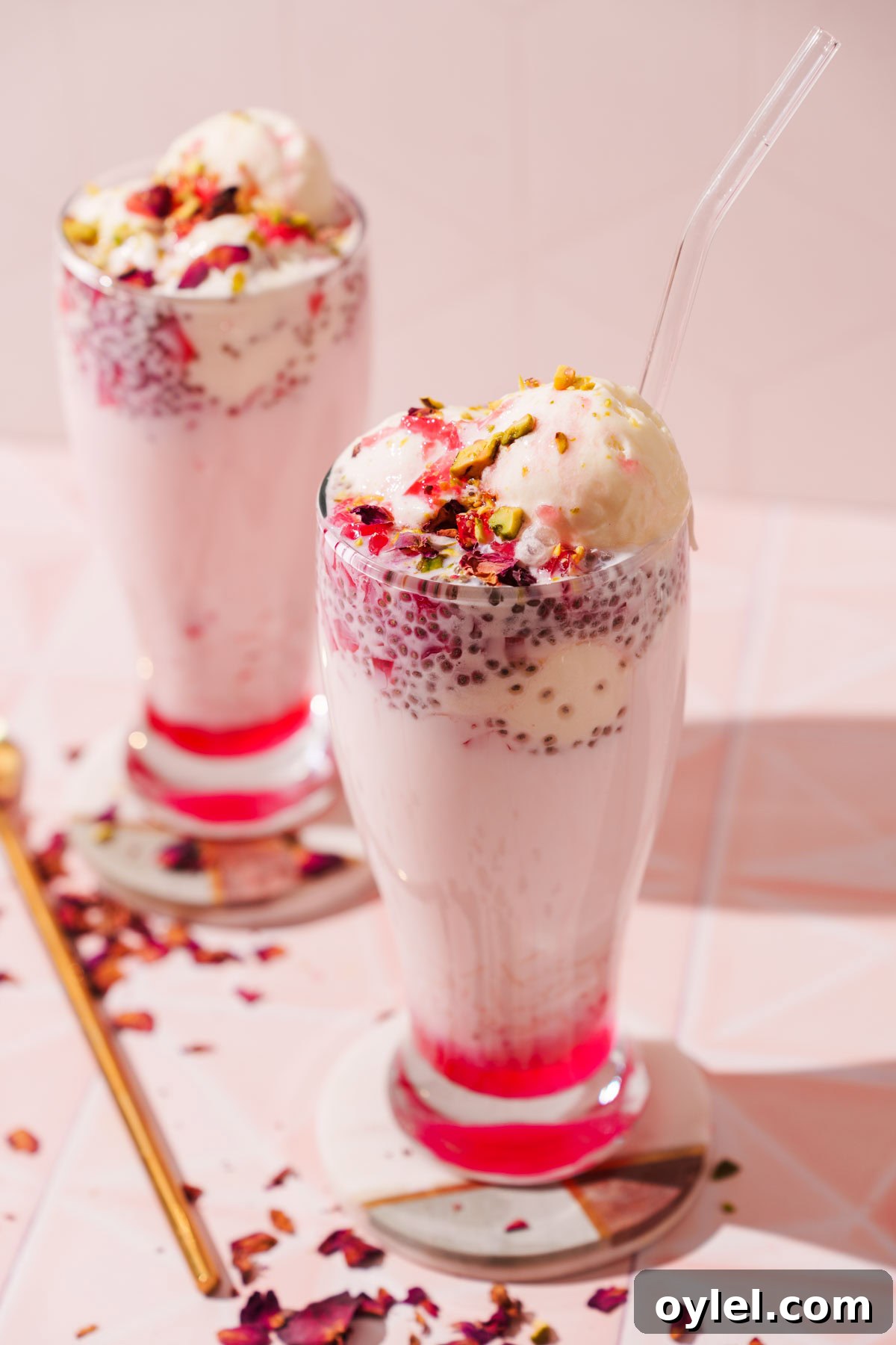 easy falooda recipe with homemade rose syrup in two tall glasses.