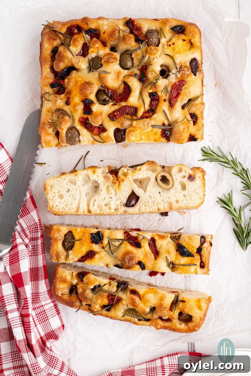 Sourdough Focaccia Recipe: Crispy Crust, Airy Interior 11 Sliced baked bread.