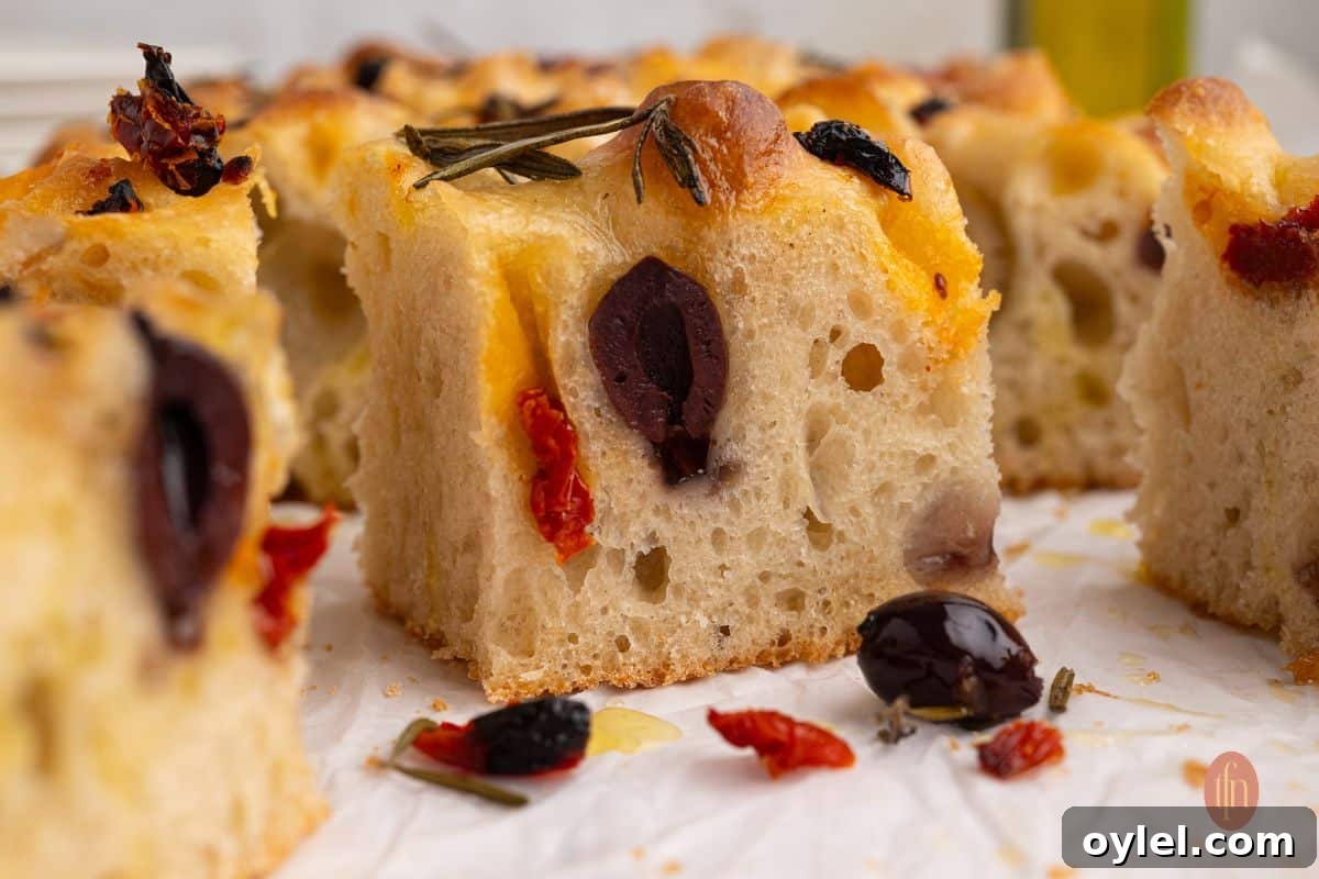 Sourdough Focaccia Recipe: Crispy Crust, Airy Interior 13 Sliced baked bread.