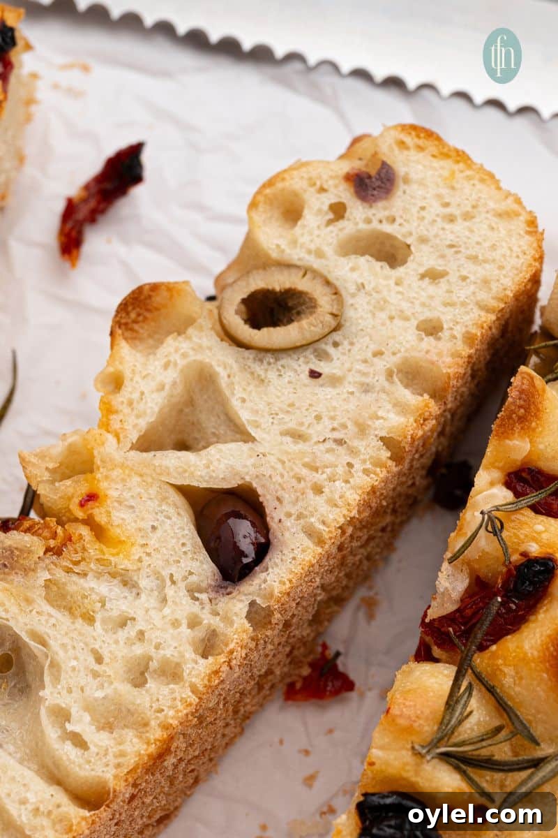 Sourdough Focaccia Recipe: Crispy Crust, Airy Interior 5 A slice of bread.