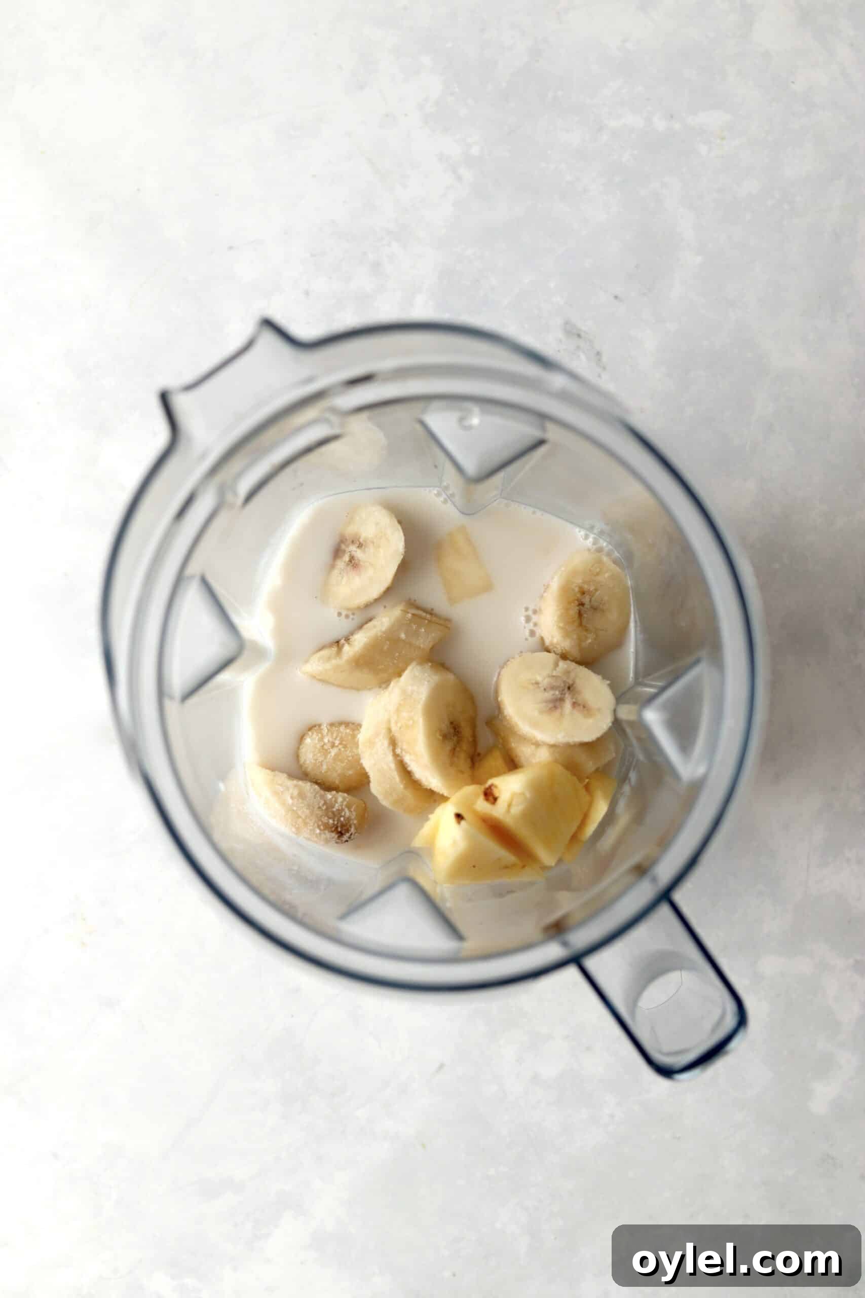 Creamy Tropical Vegan Banana and Pineapple Smoothie 4 banana, pineapple, and almond milk in blender