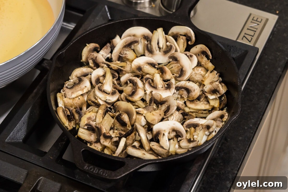 Sauteed Mushrooms with Garlic and Thyme Recipe 6 sliced mushrooms in a skillet