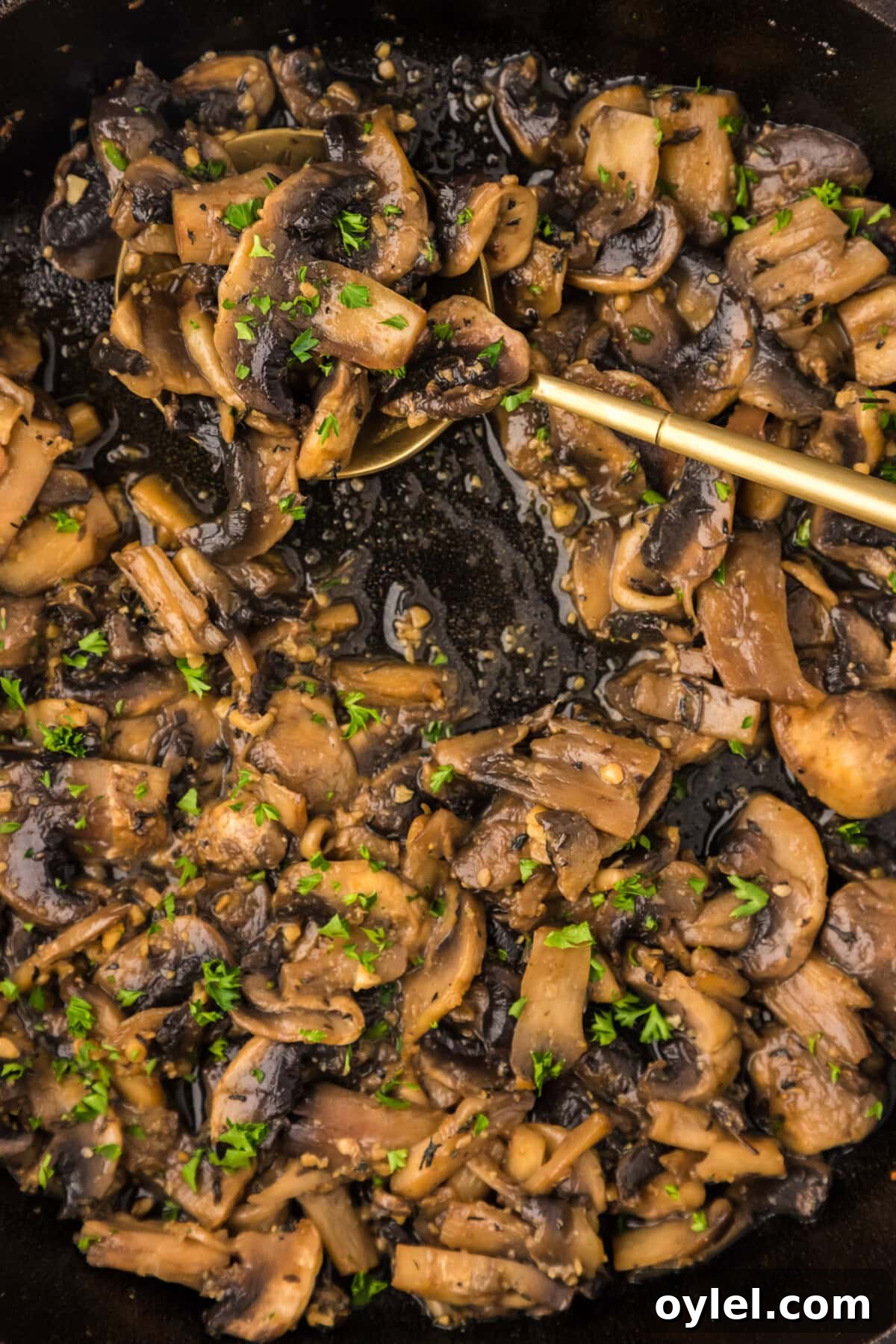 Sauteed Mushrooms with Garlic and Thyme Recipe 10 Close up photo of a skillet of Sautéed Mushrooms