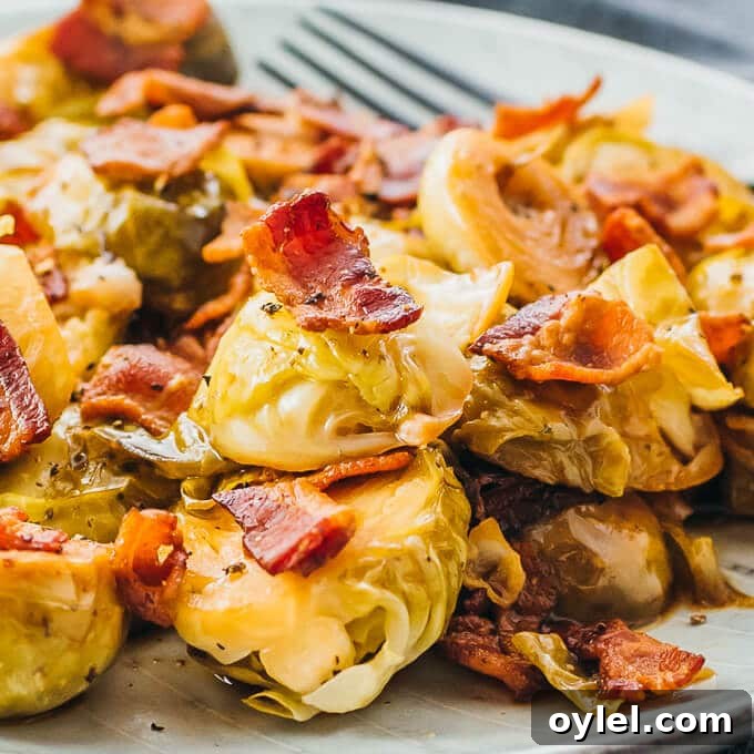 Brussels Sprouts cooked in an instant Pot topped with bacon, fork on side.