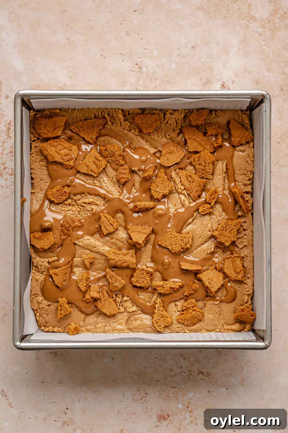 Cookies and Biscoff spread on top of fudge.